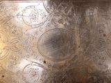 a metal tray that has a design on it