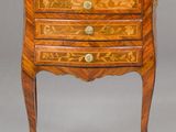 une petite commode de style Louis II en noyer et marbre marqueté