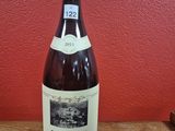 a bottle of wine that is sitting on a table