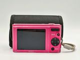 a small pink camera with a keychain attached to it