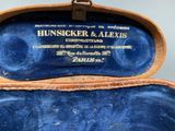 a blue case with a label on it that says hunsicker and alexis
