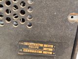 a close up of a piece of metal with holes on it