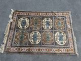 rug on the ground with a lot of different designs on it