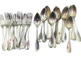 a lot of spoons and forks that are lined up together