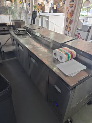 stainless steel counter top with a roll of paper on it