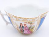 a cup that has a picture of a couple on it