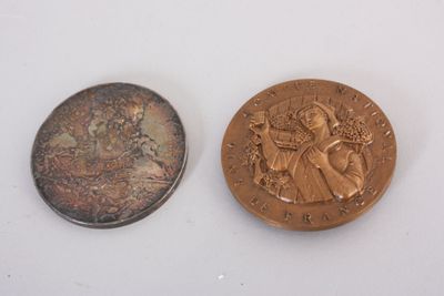 an image of a penny and a coin on a white surface