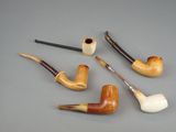 a lot of different types of pipes on the table