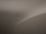 a blurry photo of a bathroom sink with a toilet paper dispenser