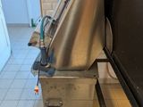 a machine that is sitting in the middle of a kitchen