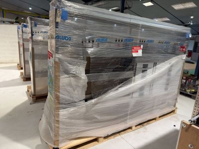 a pallet full of boxes of furniture in a warehouse