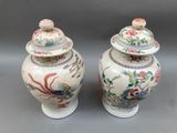 pair of chinese vases with lids decorated with flowers and birds