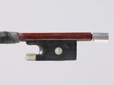 violin bow made of wood and metal on a white background