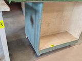 a small cabinet that is sitting in the middle of the floor