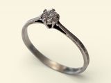a close up of a diamond ring on a white background
