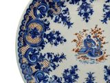 a blue and white plate with a bird design on it