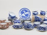 many blue and white china dishes and cups and saucers