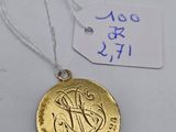 a close up of a gold coin on a string with a price tag