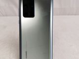 a close up of the back of a silver samsung galaxy s20