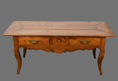 an old wooden table with two drawers and a drawer underneath it