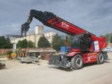 a red crane that is sitting on the side of the road