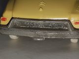 a yellow toy car that is sitting on a table