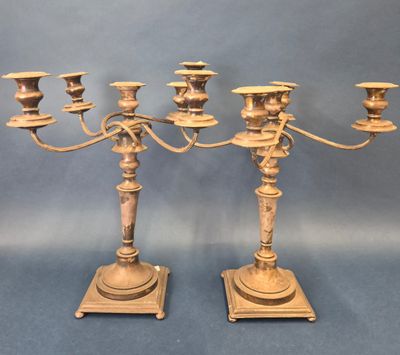 pair of antique brass candelabs on stands