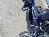 a close up of a bicycle parked on the side of the road
