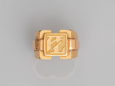 an image of a gold ring with the letter n on it