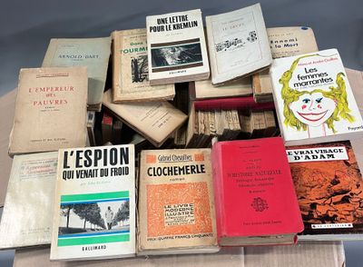 many books that are stacked on top of each other