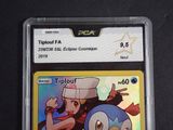 a close up of a pokemon trading card on a table
