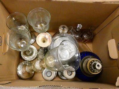 a box full of empty wine glasses and a bottle