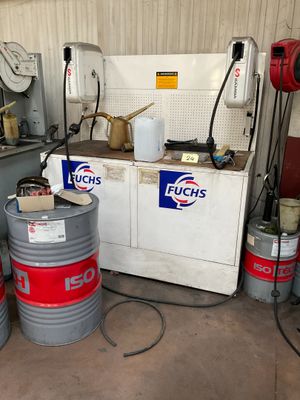a bunch of barrels that are sitting in a garage