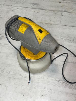 an image of a floor sander on the floor