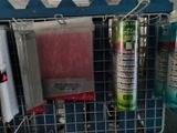 a wire rack with several different types of cleaning products