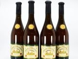 three bottles of wine sitting next to each other on a white surface