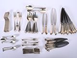 many different types of silverware on the table