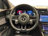 a picture of the interior of a car with a steering wheel and dashboard