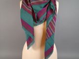 purple and green striped scarf on a mannequin head