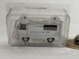 a small toy bus that is in a clear box