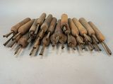 an image of a pile of wood chisels sitting on a table