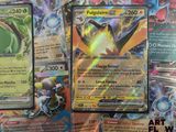 several pokemon cards sitting on top of each other on a table