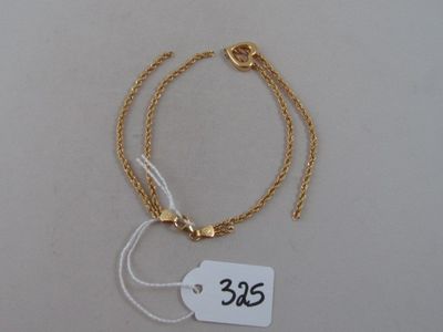 gold plated bracelet with a price tag on a white background