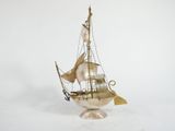 a small model of a sailboat on a stand