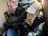 a cardboard box filled with assorted items in a parking lot