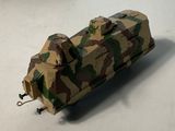 a model of a military vehicle on a white surface