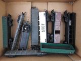 a box full of toy train cars and a box of other toy trains