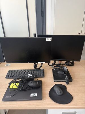 two computer monitors and a mouse on a desk