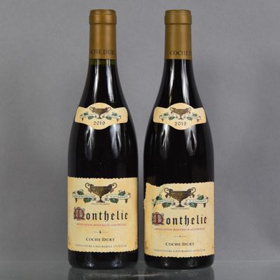 two bottles of wine sitting next to each other on a table