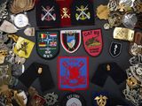 a lot of badges and badges on a table